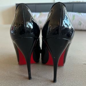 Black Christian Louboutin pumps with suede detail